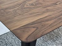 Close view of walnut-grain tabletop surface