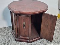 Full view of side table with door open showing interior storage