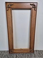 Full front view of wood frame showing overall design and finish