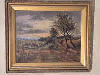 Front view of framed landscape painting
