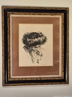 Full view of framed lithograph in ornate frame