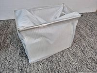 Magazine rack wrapped in protective fabric