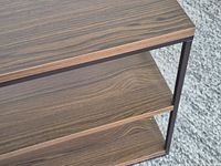 Close-up of shelf surface illustrating wood-grain finish