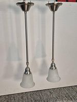 Full view of both pendant lights showing overall design and finish