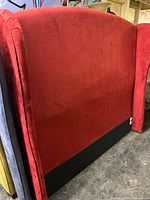 Full view of red velvet wingback headboard