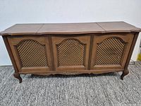 Front view of wooden Claritone console stereo showing three lattice speaker panels and cabriole legs