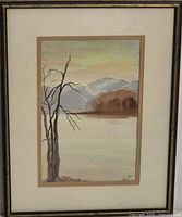 framed watercolour landscape with tree, mountains and lake