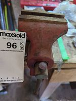 overall view of red cast iron bench vise mounted on workbench