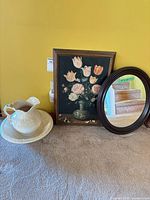 Group view of pitcher, basin, painting, and mirror