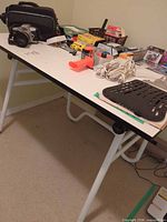 Overall view of folding table with items on top