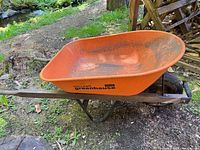 Left side view showing brand, tub, frame, single wheel