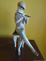 Front view of entire figurine showing pose and colors