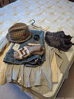 All clothing, shoes, and accessories arranged on bed