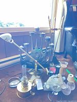 Group view showing candelabra, desk lamp, fireplace tools and assorted items