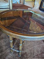 Top view showing oval glass inset and wood frame