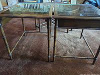 Both end tables side by side showing glass tops and bamboo style legs