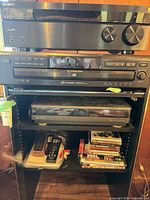 Front view of receiver, CD changer, VCR in cabinet