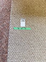 Overall view of taupe/beige rectangular rug on floor
