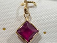 Front view of 10K ruby pendant