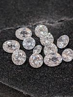 Close-up of loose cubic zirconia stones showing cuts and clarity