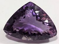 Front view of trilliant-cut purple amethyst