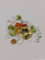 Group of assorted loose gemstones on white background