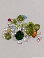 Close-up of assorted loose multicolour faceted gemstones