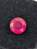 close-up of ruby showing facets and colour