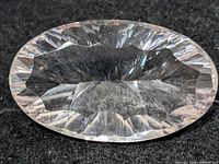 Top view of oval faceted white topaz