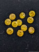 group of yellow diamonds on black background