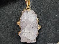 Front view of silver pendant showing full druzy cluster and mounting