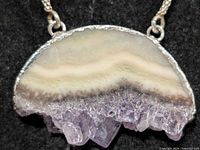 Front view close-up of agate/quartz pendant showing crystal formation
