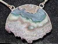 Close-up of agate quartz druzy pendant front view