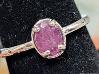 Front view showing dyed ruby and prong setting