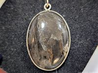 Full front view showing gemstone and silver bezel