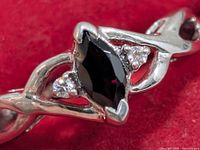 Close-up of garnet and CZ setting