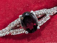 Front close-up showing garnet and CZ arrangement
