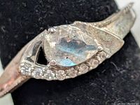 Close view of labradorite stone, accent stones and setting