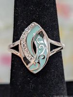 Front view of ring showing cubic zirconia row and enamel design
