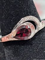 Front view showing pear garnet and swirl accent
