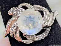 front view of ring showing moonstone and CZ accents