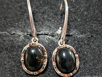 front view of both silver amber earrings