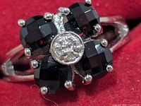 Top view showing four garnets and central clear-stone cluster