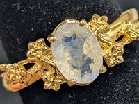 Top view showing oval moonstone and floral shoulders