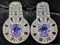 Front view showing amethyst centers and CZ halos