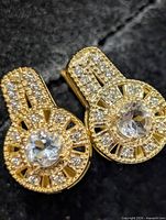 Frontal view of both earrings showing gemstone arrangement