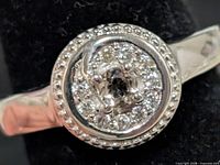 Front view of ring showing central CZ and pavé halo details