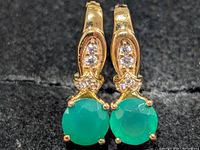 front view of both earrings showing green onyx and clear stones