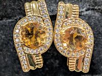 Front view of both earrings showing citrine centers and CZ halo