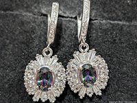 front view of both earrings showing stones and halo setting